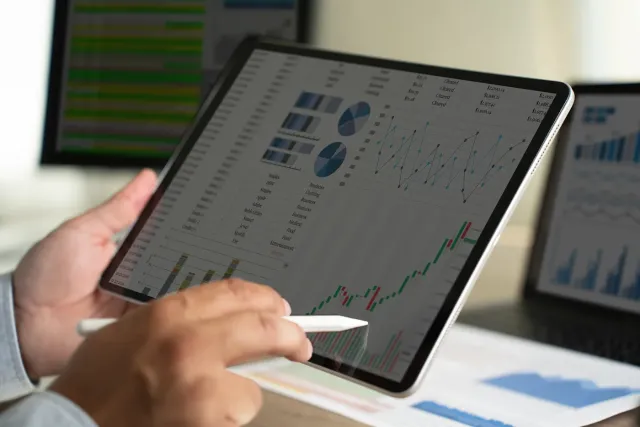 Person reviewing charts on a tablet